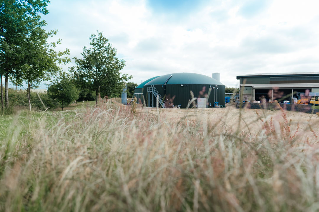 green food waste anaerobic digester tanks nestled in northamptonshire farmland 